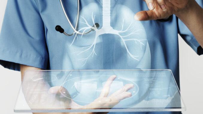 doctors using transparent tablet with hologram medical technology
