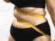 obesity problems plus size female hate her body beauty standards bands centimeter measuring tape insecure needs healthy weight loss diet anonymous medium studio shot photo white background