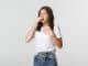 young woman with allergy sneezing girl feeling sick having runny nose