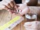 doctor is assist patient eat medicine tablet pillbox correctly